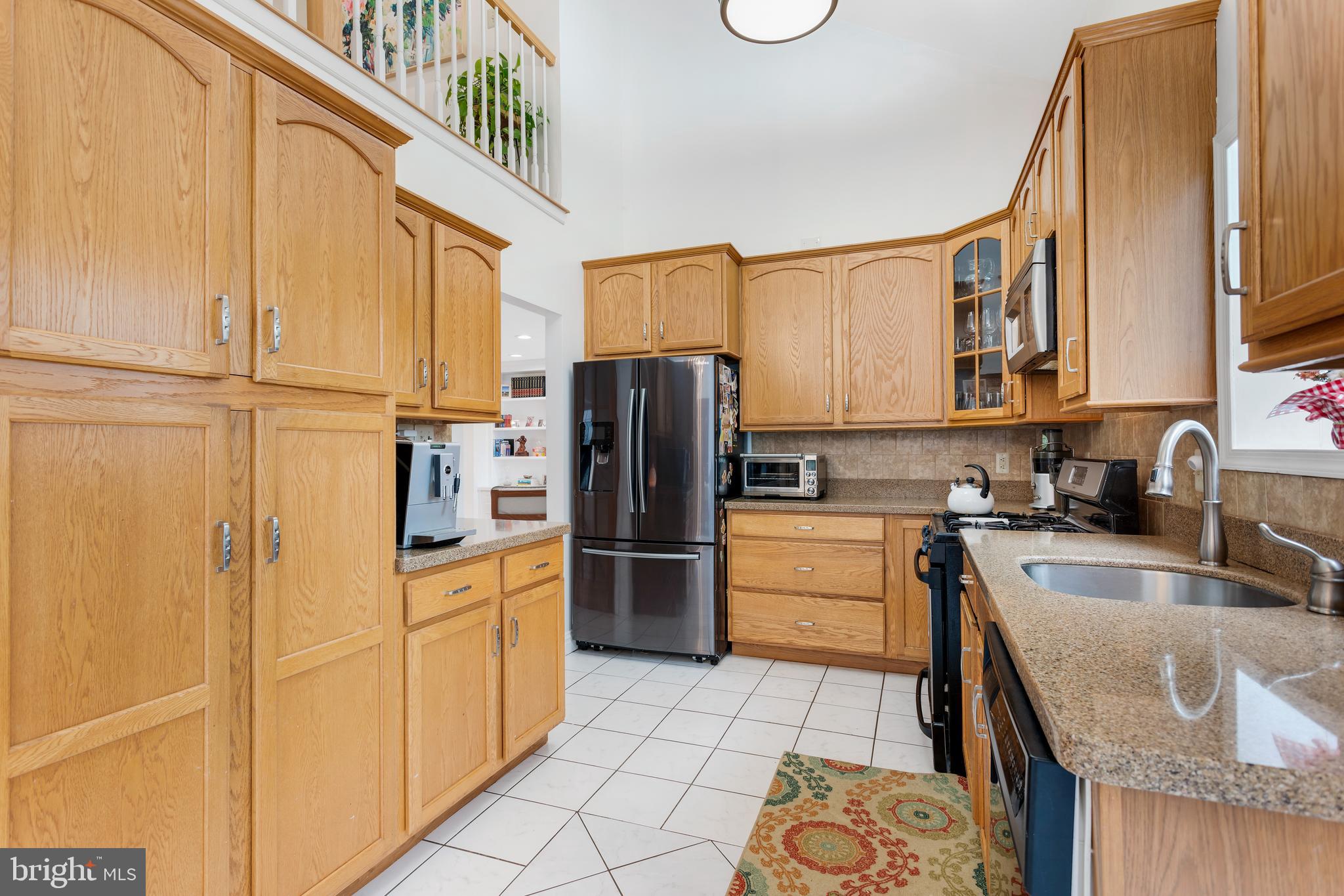135 Cornflower Road Trenton, NJ 08620 - Photo 14 of 31 a kitchen with a refrigerator sink and cabinets