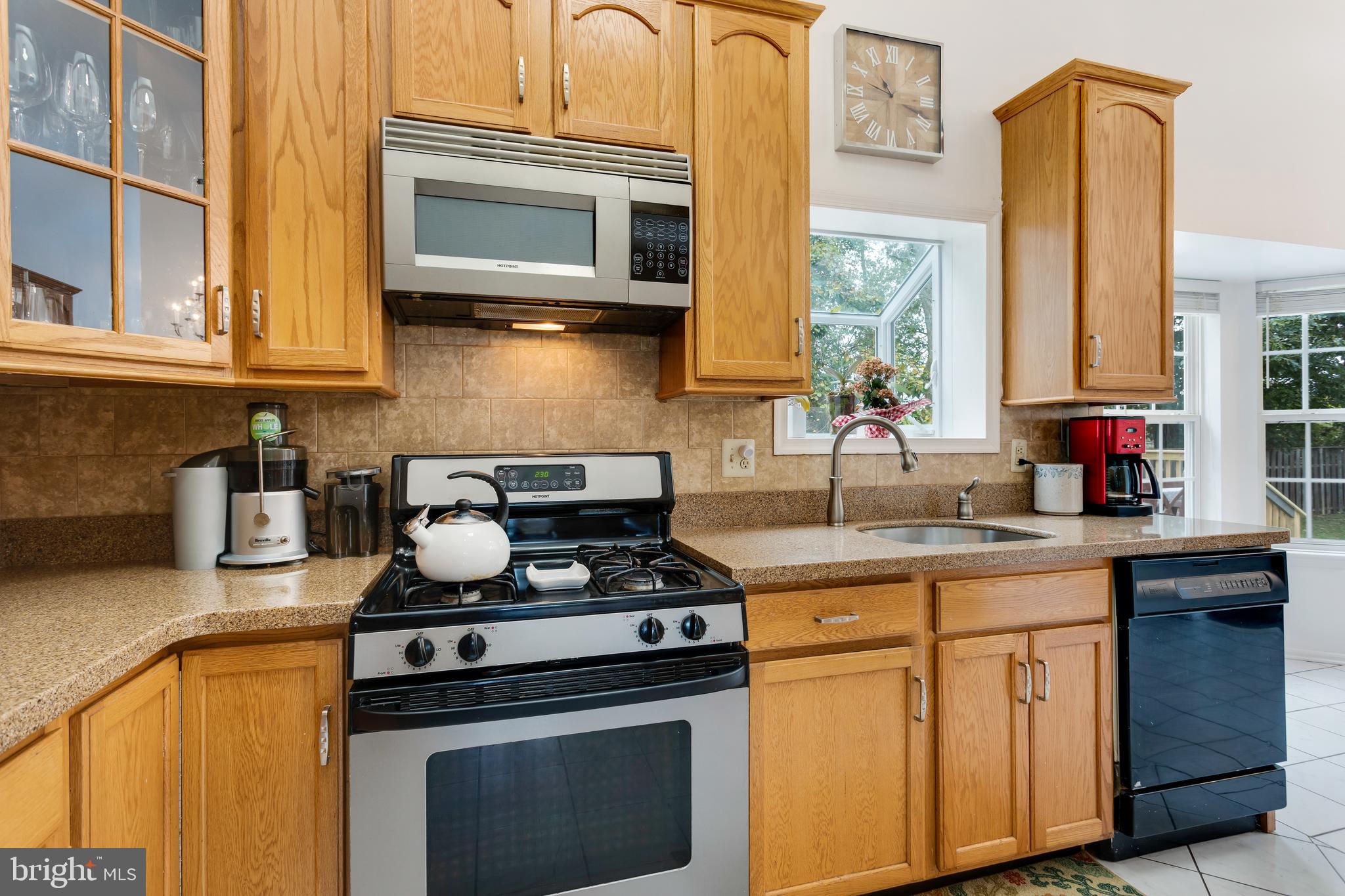 135 Cornflower Road Trenton, NJ 08620 - Photo 15 of 31 a kitchen with stainless steel appliances granite countertop a stove a sink and a microwave