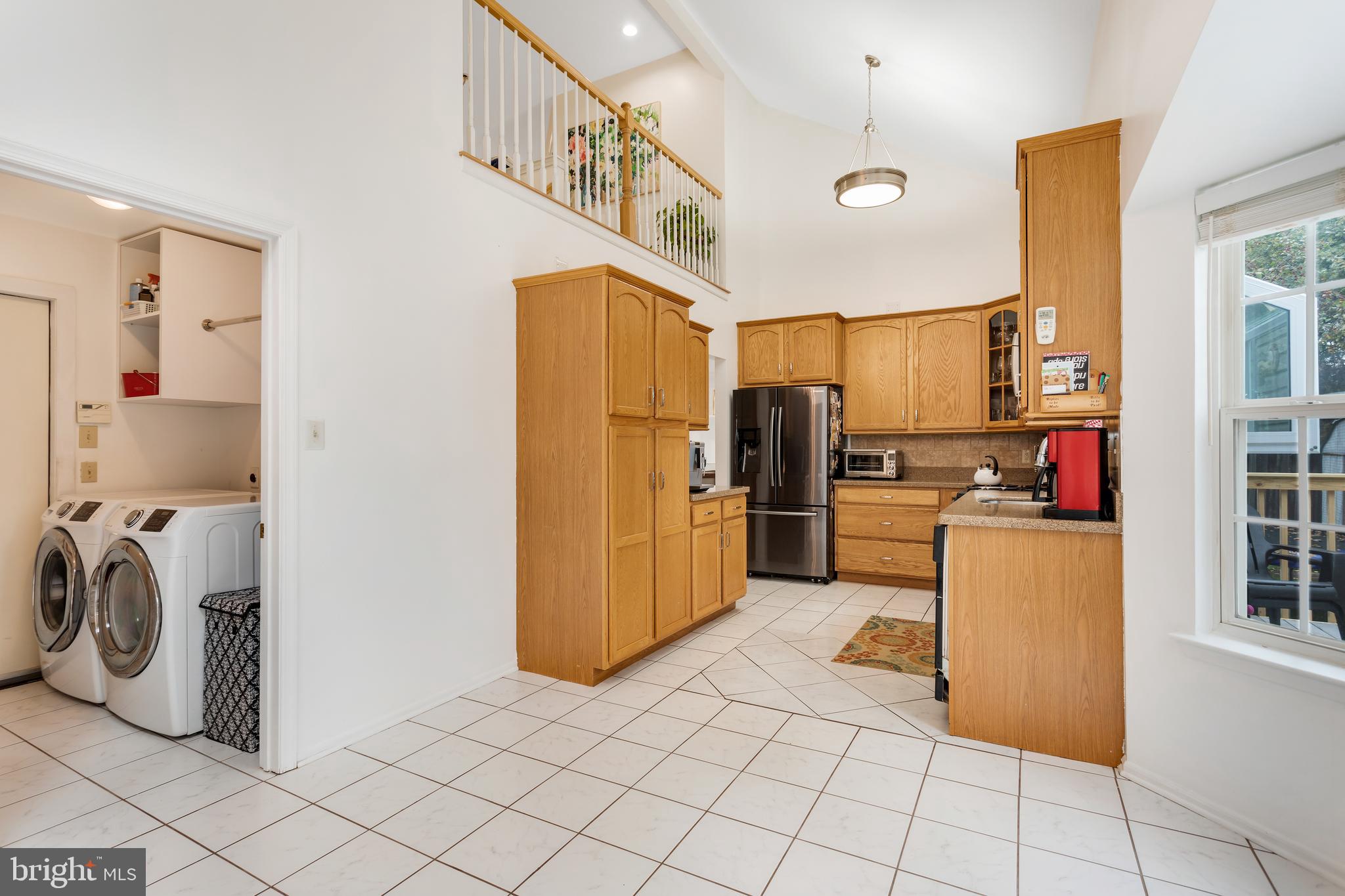 135 Cornflower Road Trenton, NJ 08620 - Photo 16 of 31 a kitchen with cabinets and a refrigerator