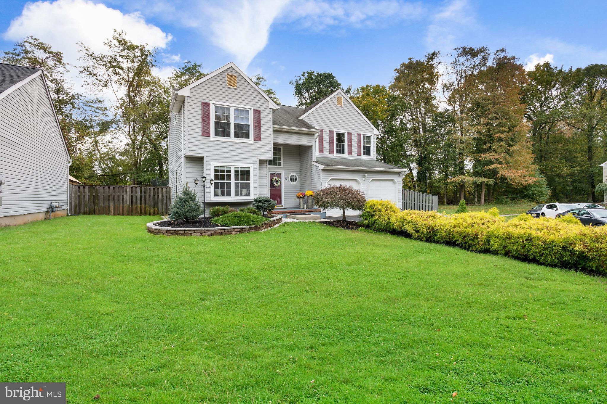 135 Cornflower Road Trenton, NJ 08620 - Photo 3 of 31 a front view of a house with yard and green space