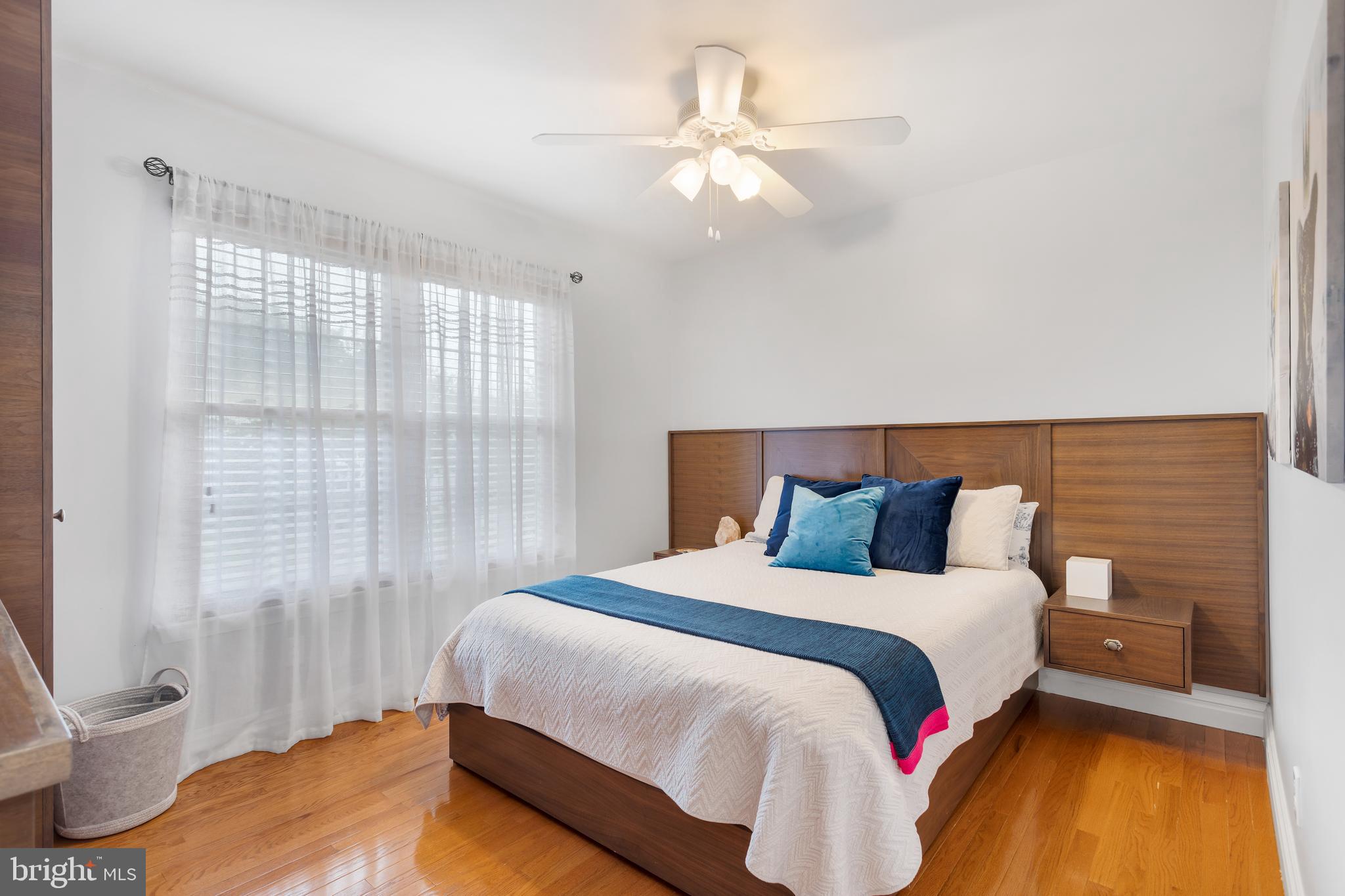 135 Cornflower Road Trenton, NJ 08620 - Photo 24 of 31 a bedroom with a bed and a chandelier