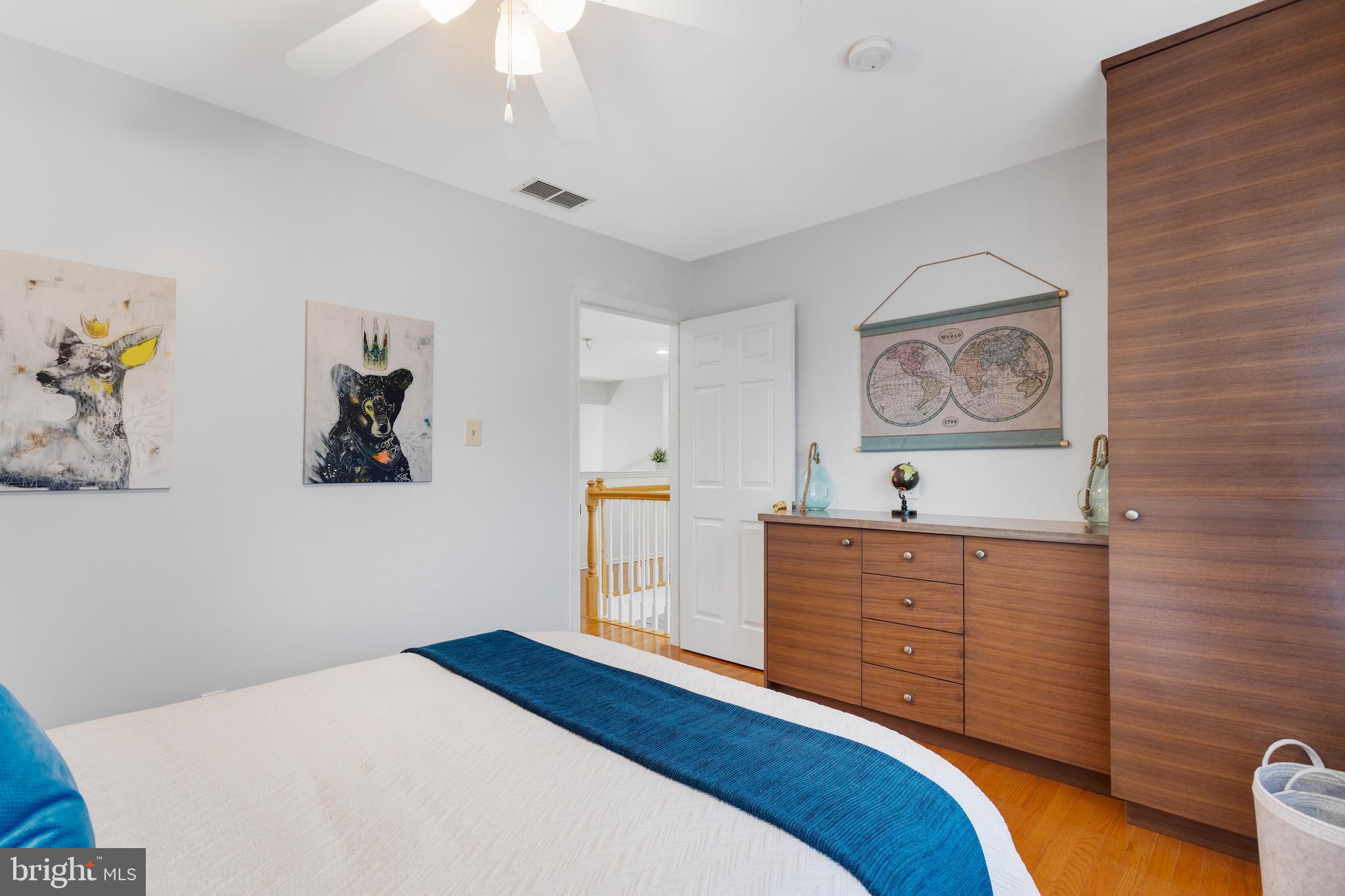 135 Cornflower Road Trenton, NJ 08620 - Photo 25 of 31 a bedroom with a bed and painting on the wall