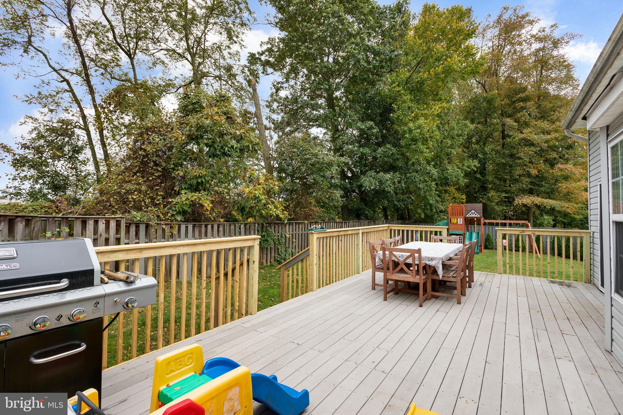135 Cornflower Road Trenton, NJ 08620 - Photo 6 of 31 a view of a deck with furniture and trees