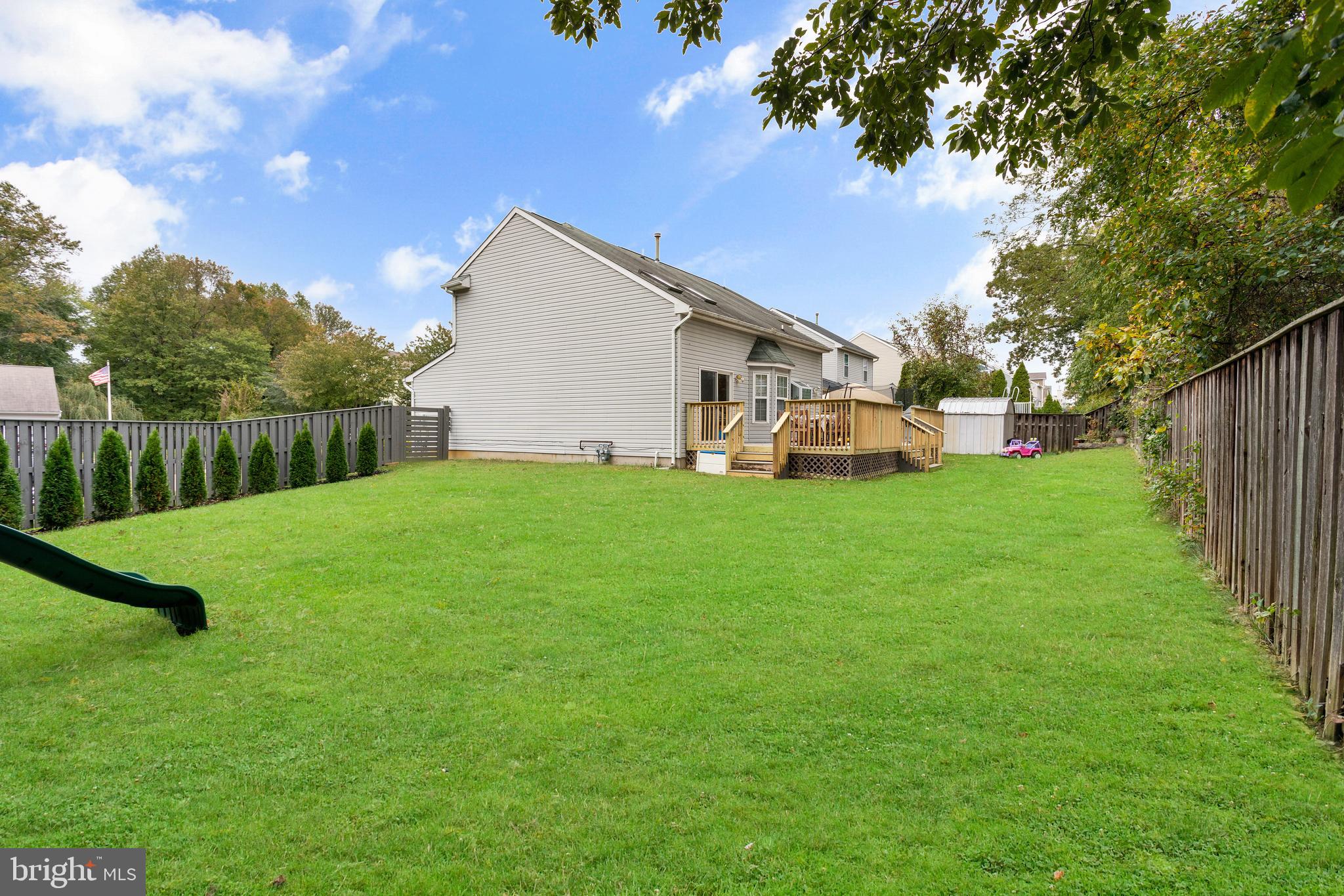 135 Cornflower Road Trenton, NJ 08620 - Photo 8 of 31 a view of a house with a yard and sitting area