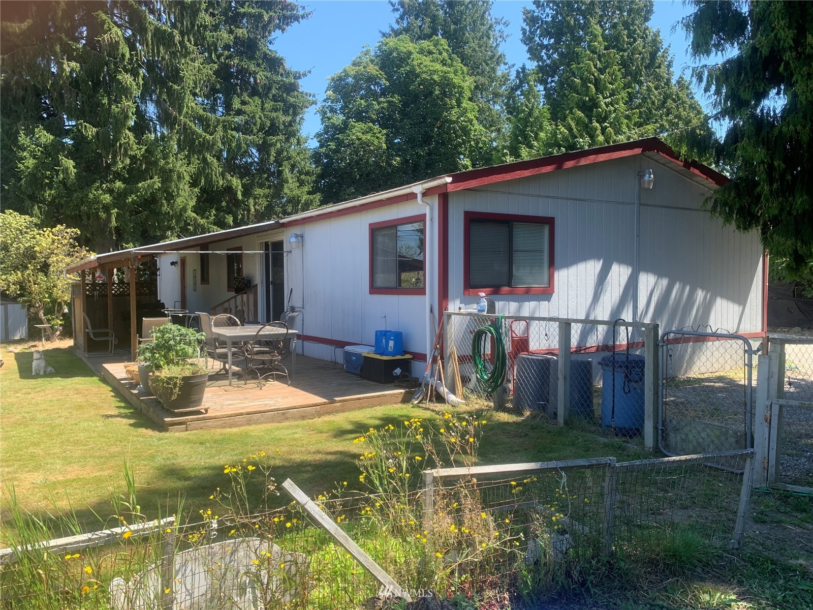 12419 Military Road South Seattle, WA 98168 - Photo 5 of 24 a view of a house with backyard and sitting area