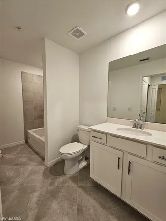 a bathroom with a glass door shower