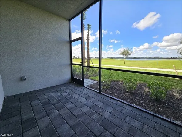 a view of a back yard from a balcony