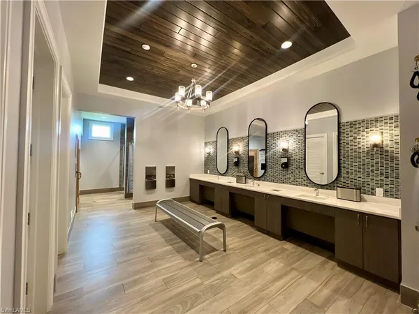 a living room with lots of furniture and clutter