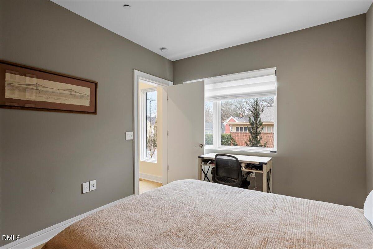 206 Dundas Lane Raleigh, NC 27603 - Photo 17 of 30 a bedroom with a bed and a desk