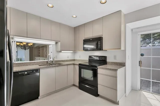 an empty room with closet and a ceiling fan