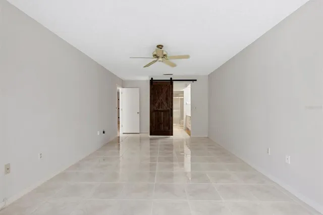 an empty room with a empty space and windows