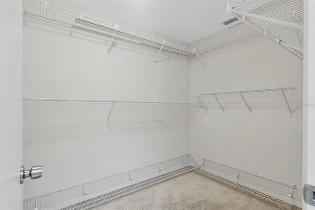 a bathroom with a sink toilet vanity and shower