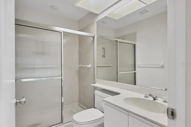 a view of an entryway with wooden floor and windows