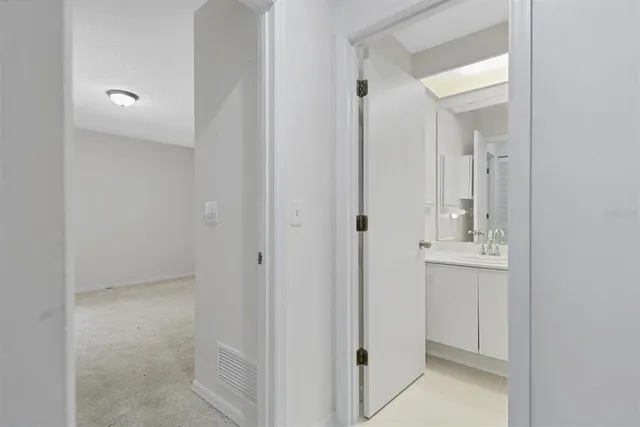 a kitchen with a stove and a white cabinet