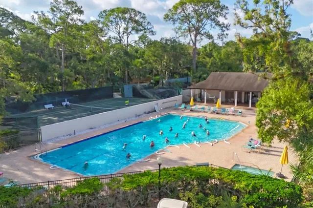 a lots of white furniture and wooden floor