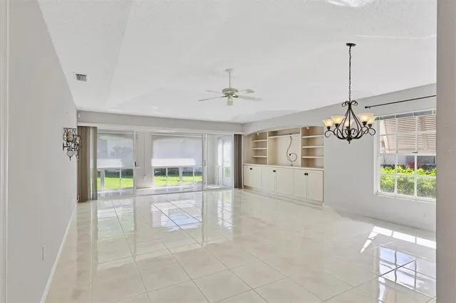 a view of a big room with closet and windows
