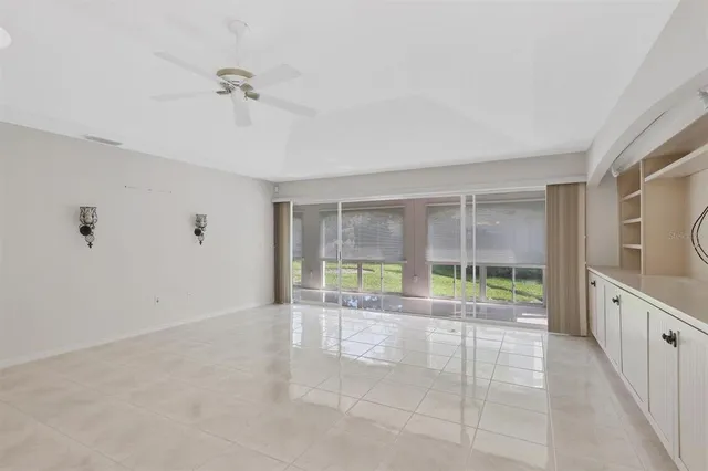 a kitchen with granite countertop a refrigerator stove top oven and sink