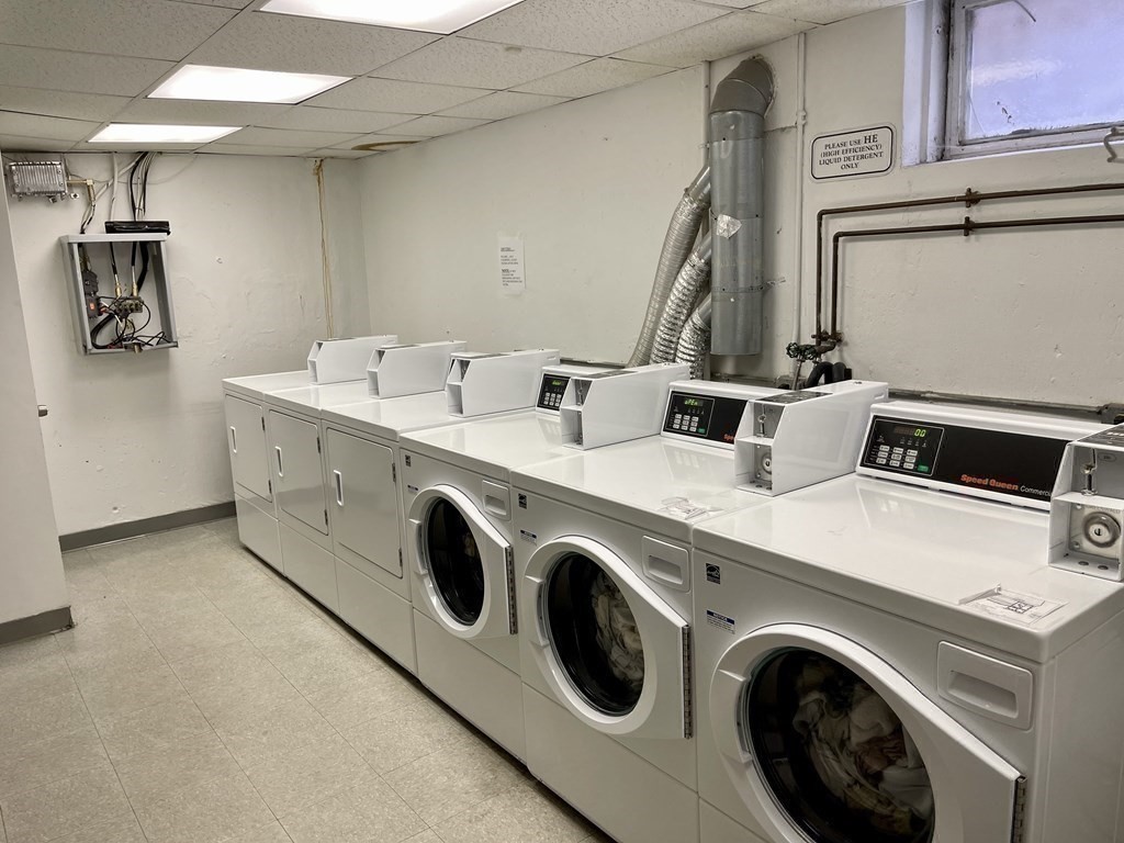 100 Marion Street, Unit 18 Brookline, MA 02446 - Photo 9 of 19 a utility room with dryer and washer