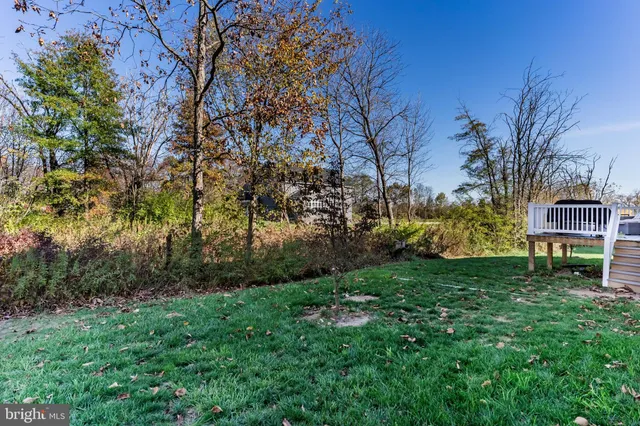 a view of a lake with a yard