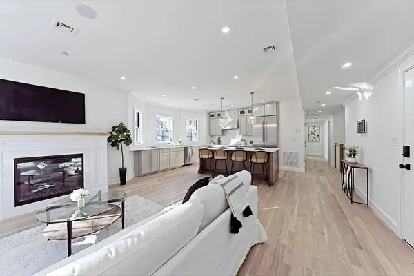 a living room with furniture fireplace and flat screen tv