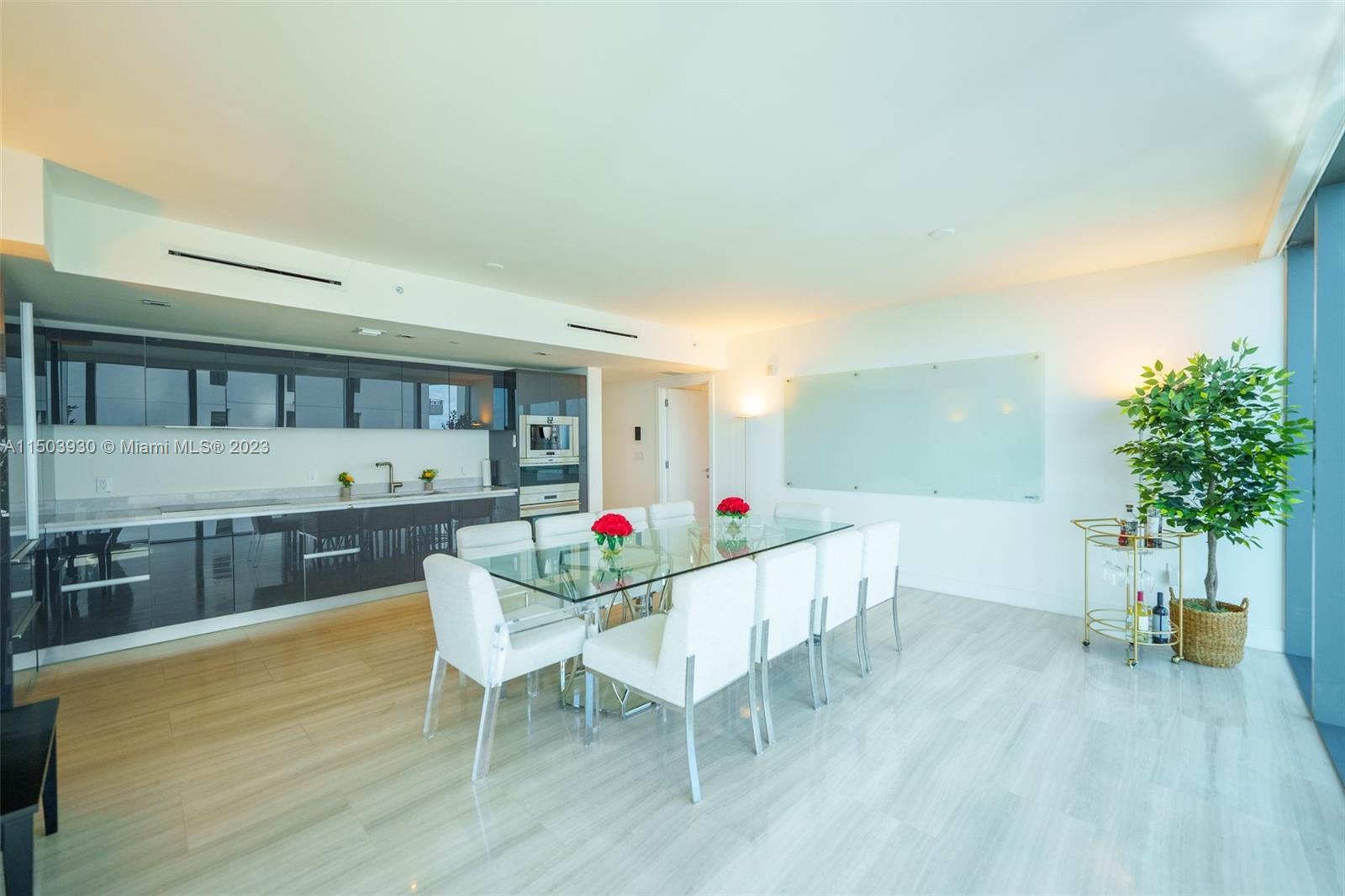 1451 Brickell Avenue, Unit 1803 Miami, FL 33131 - Photo 11 of 35 a living room with furniture and a wooden floor