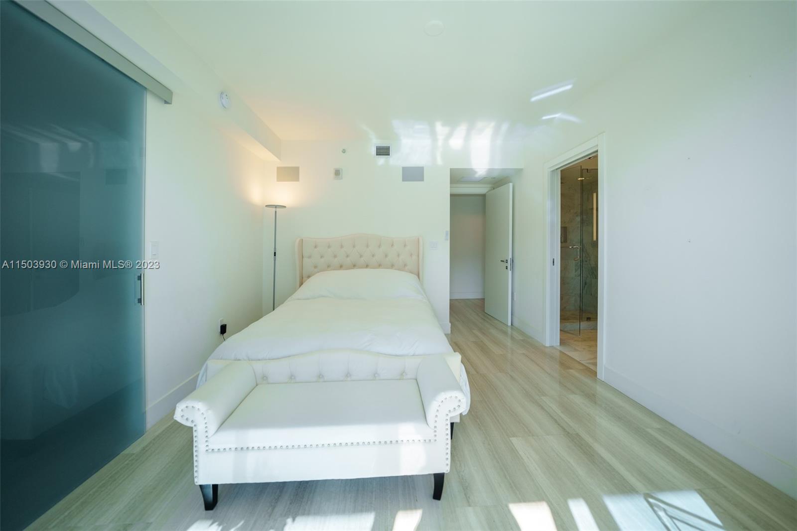 1451 Brickell Avenue, Unit 1803 Miami, FL 33131 - Photo 15 of 35 a en suite bathroom with a sink and shower