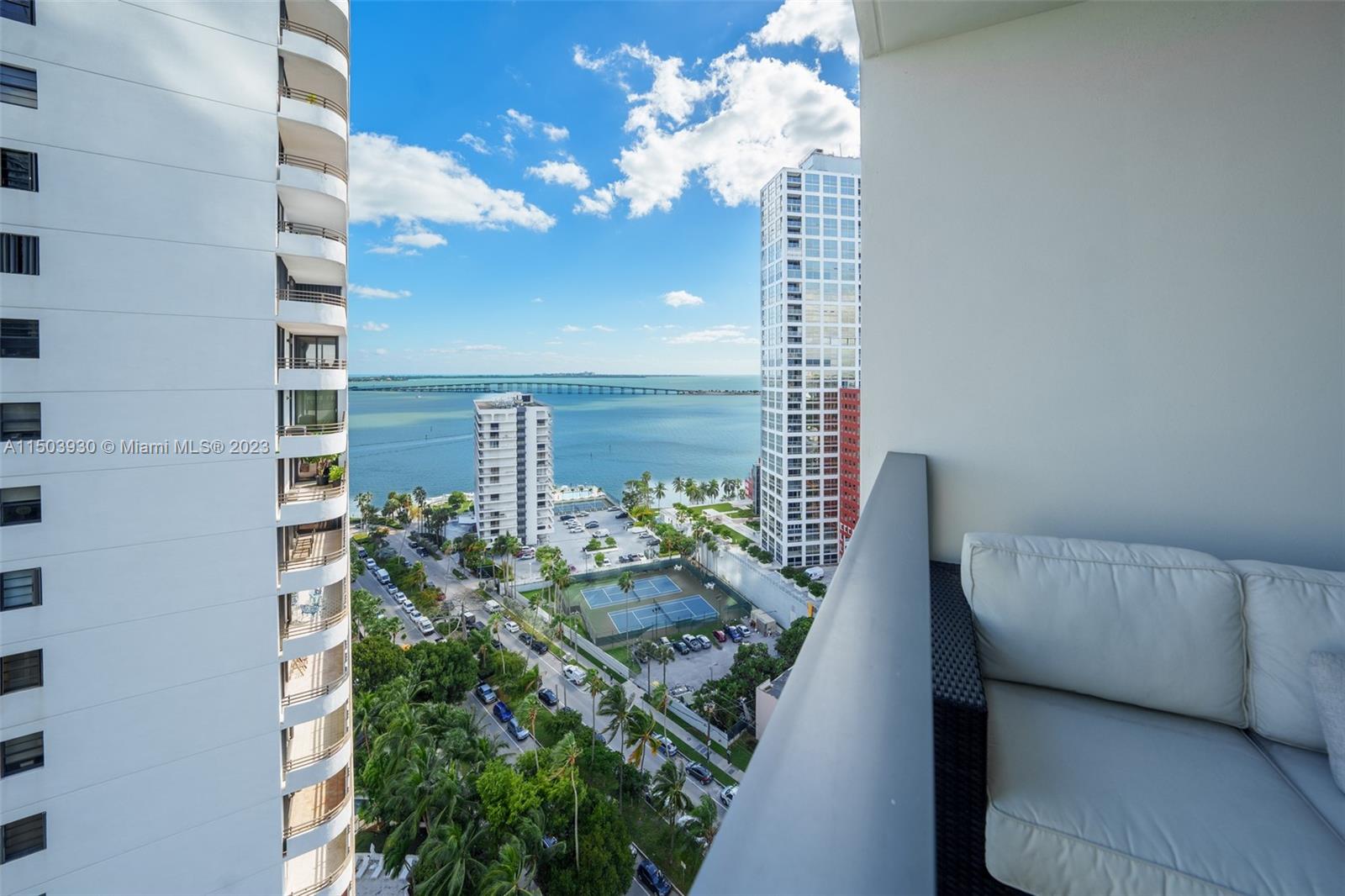 1451 Brickell Avenue, Unit 1803 Miami, FL 33131 - Photo 35 of 35 a vase of flowers sitting on a floor with potted plants