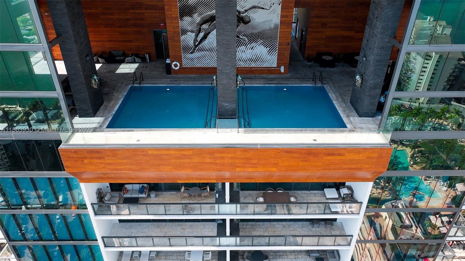 1451 Brickell Avenue, Unit 1803 Miami, FL 33131 - Photo 5 of 35 a view of small pool with seating area