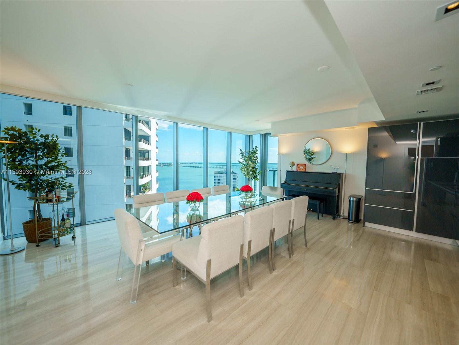 1451 Brickell Avenue, Unit 1803 Miami, FL 33131 - Photo 8 of 35 a living room with furniture and a potted plant