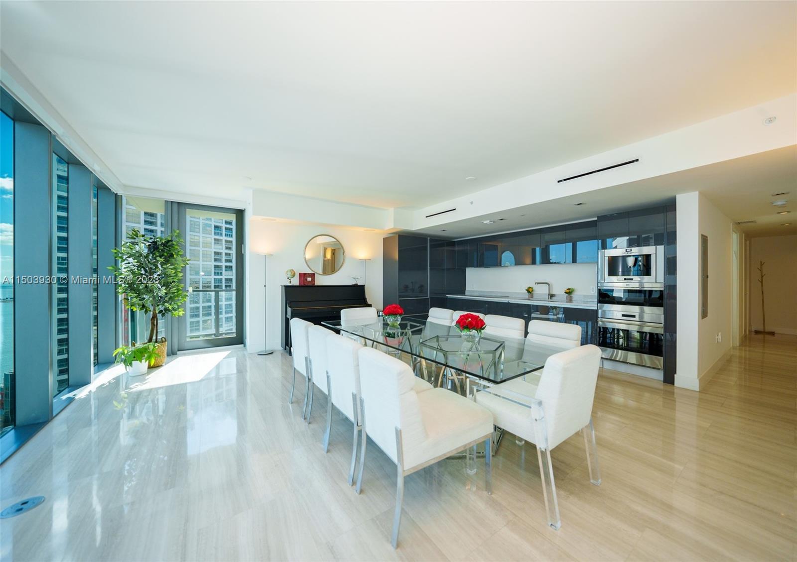 1451 Brickell Avenue, Unit 1803 Miami, FL 33131 - Photo 9 of 35 a living room with furniture and wooden floor