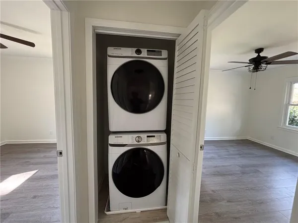 a view of a hallway with washer and dryer