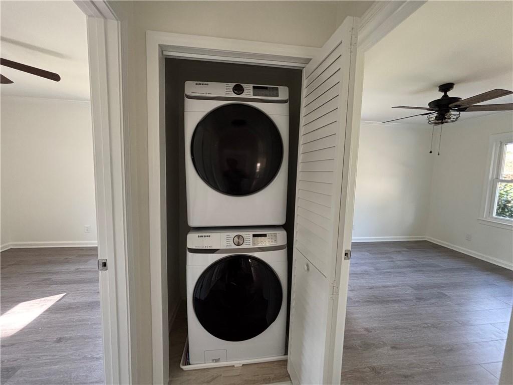 3854 Davis Street Suwanee, GA 30024 - Photo 19 of 24 a view of a hallway with washer and dryer
