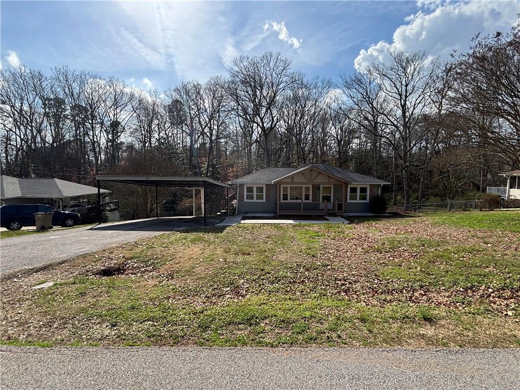 3854 Davis Street Suwanee, GA 30024 - Photo 2 of 24 a view of house with outdoor space