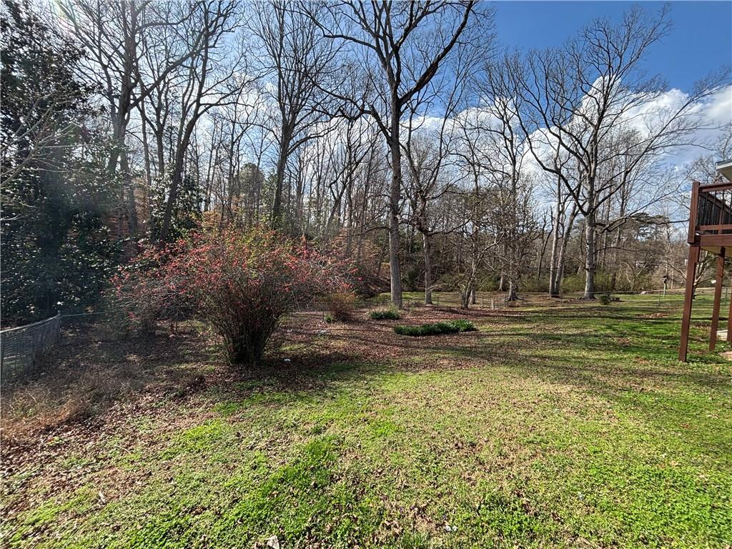 3854 Davis Street Suwanee, GA 30024 - Photo 24 of 24 a view of a yard with large trees