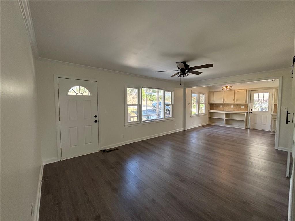 3854 Davis Street Suwanee, GA 30024 - Photo 5 of 24 wooden floor in an empty room with a window