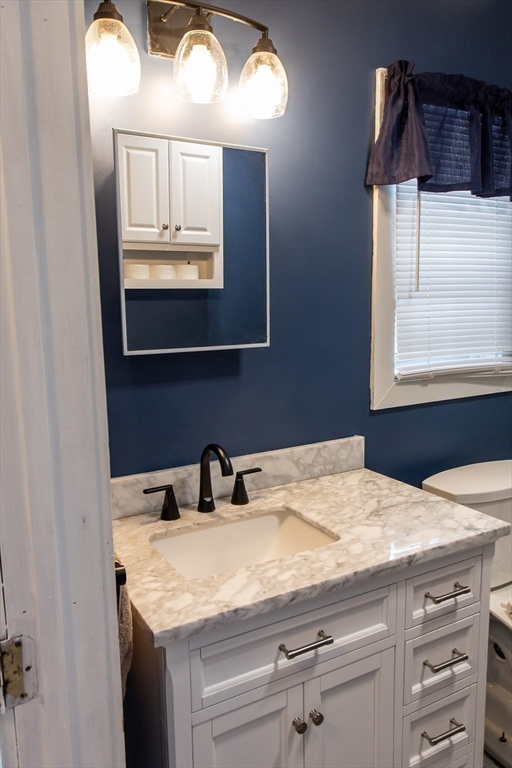 20 Paige Hill Road Brimfield, MA 01010 - Photo 21 of 40 a bathroom with a sink a vanity and a mirror