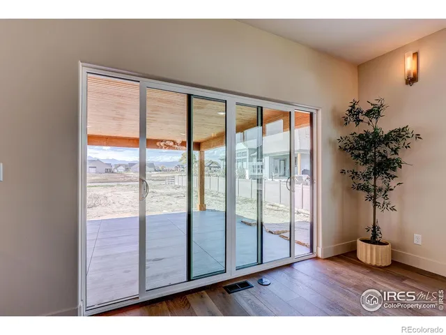 a view of front door with wooden floor