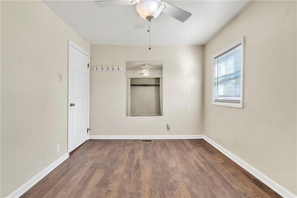 841 Railroad Street McKees Rocks, PA 15136 - Photo 20 of 44 a view of empty room with wooden floor and ceiling fan
