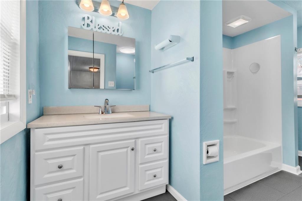 841 Railroad Street McKees Rocks, PA 15136 - Photo 22 of 44 a spacious bathroom with a tub sink and a mirror