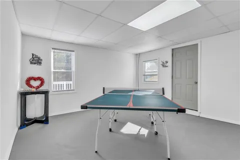 a room with a table and white walls