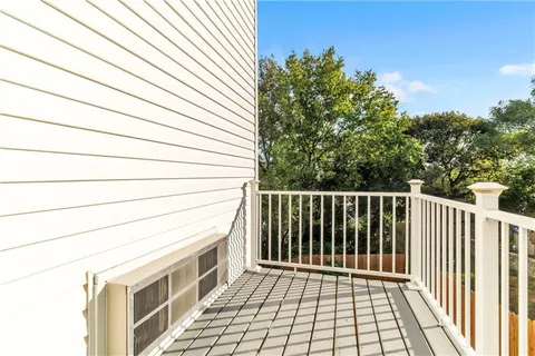 a view of a backyard with wooden fence