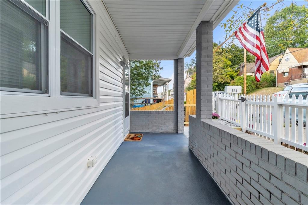 841 Railroad Street McKees Rocks, PA 15136 - Photo 6 of 44 a view of a house with porch and wooden floor