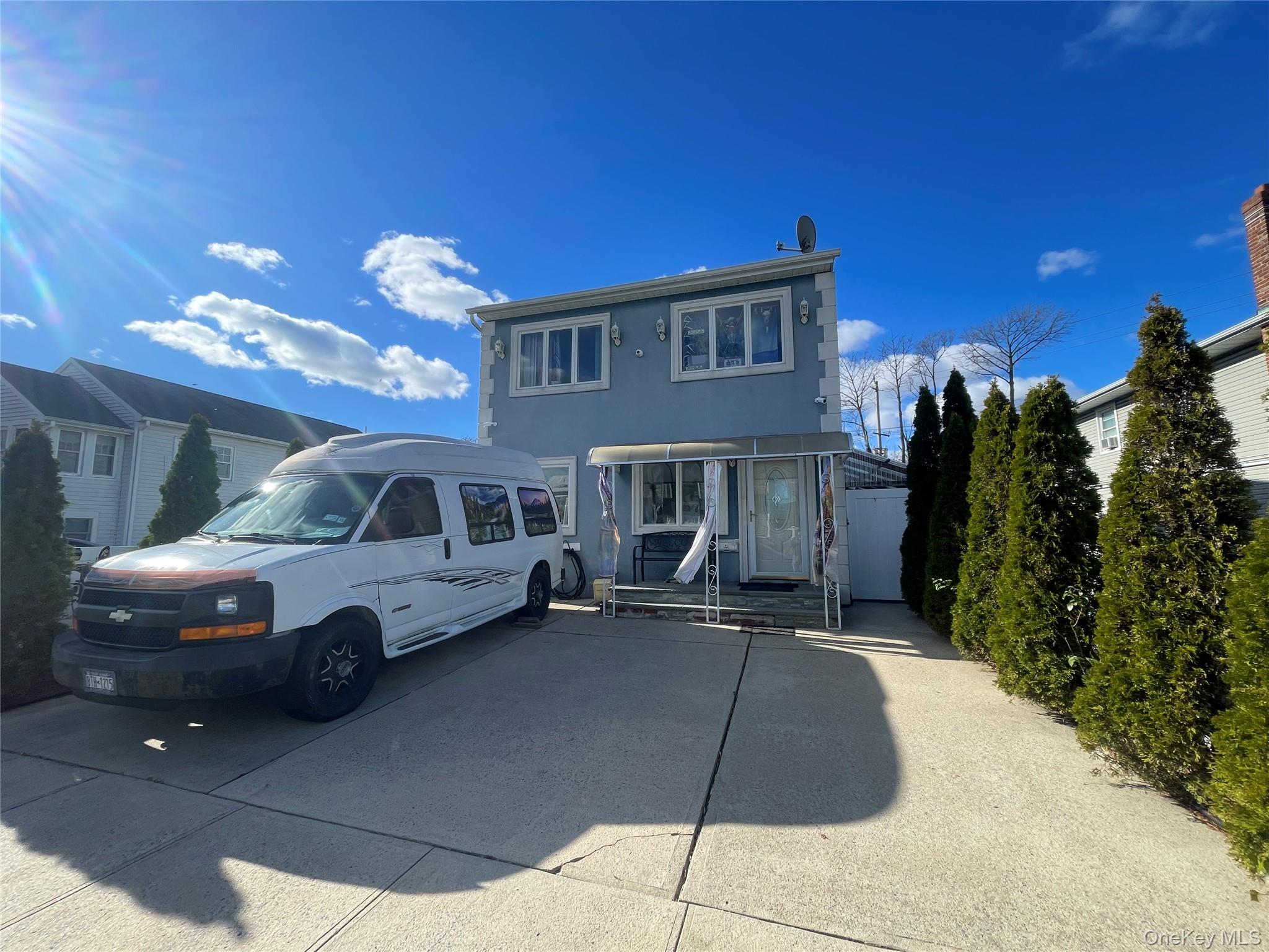 a front view of a house with parking space