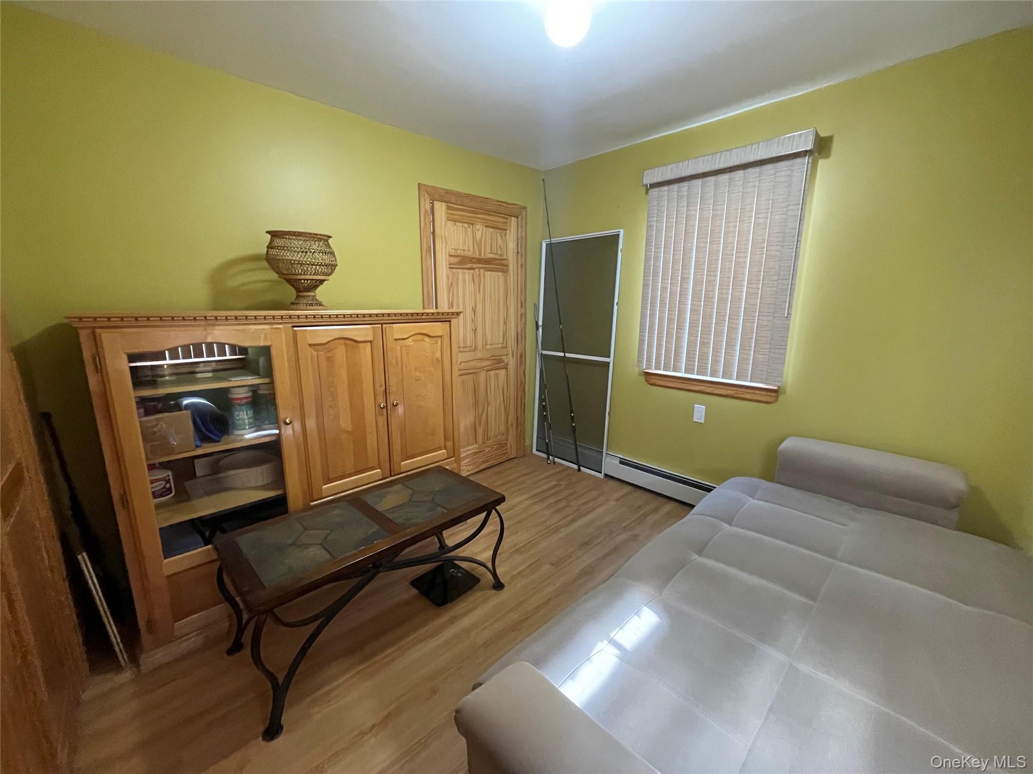 104 Ostend Road Island Park, NY 11558 - Photo 11 of 42 a living room with furniture