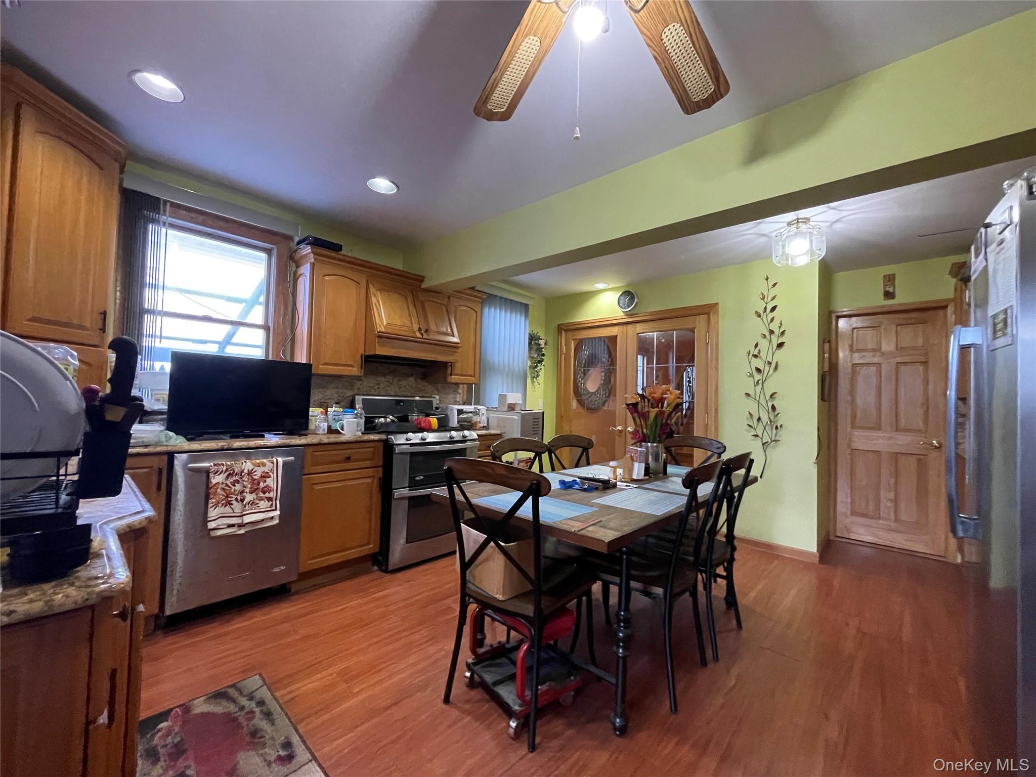 104 Ostend Road Island Park, NY 11558 - Photo 19 of 42 a view of a dining room with furniture window and wooden floor
