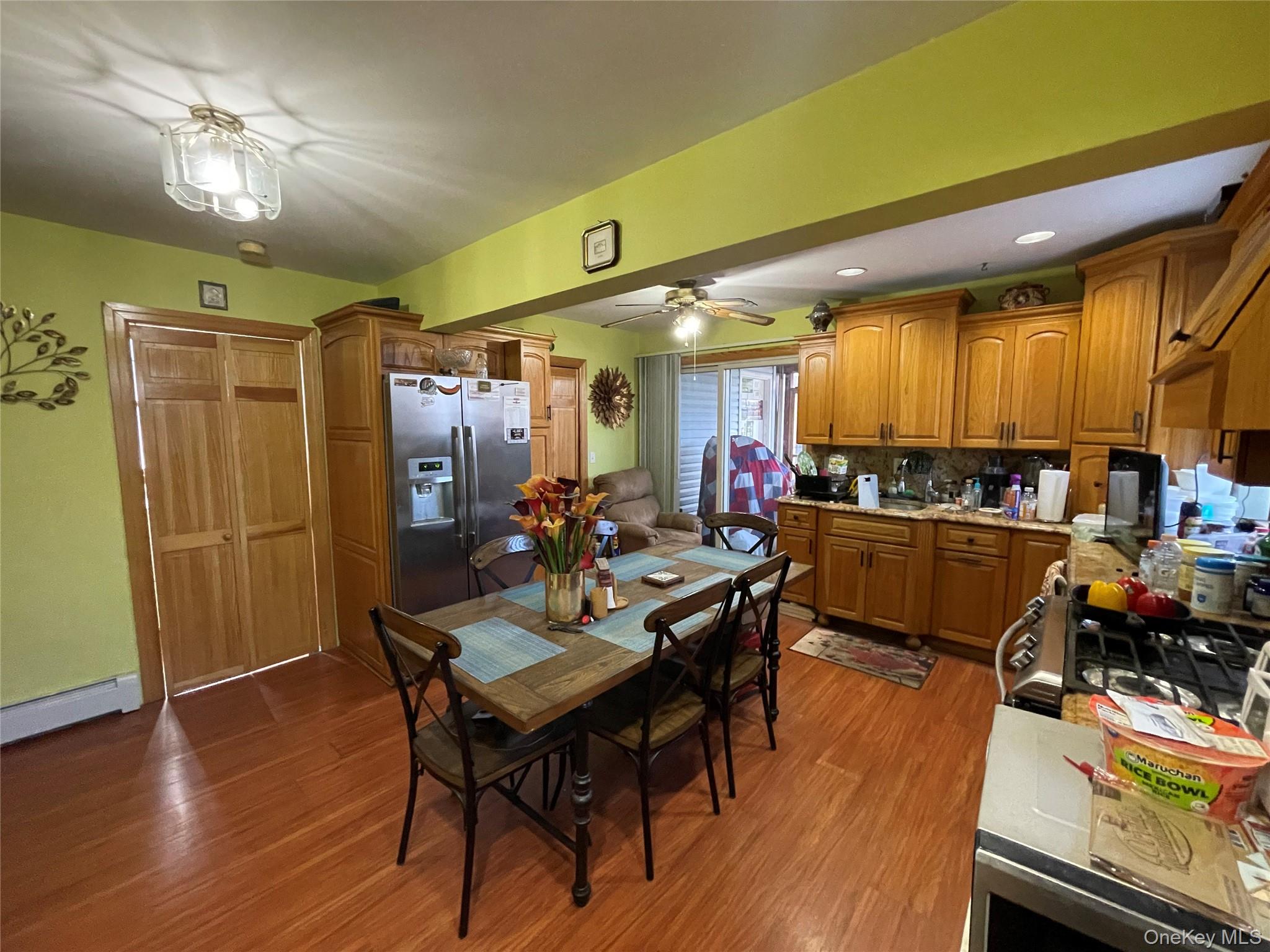 104 Ostend Road Island Park, NY 11558 - Photo 21 of 42 a view of a dining room with furniture and wooden floor
