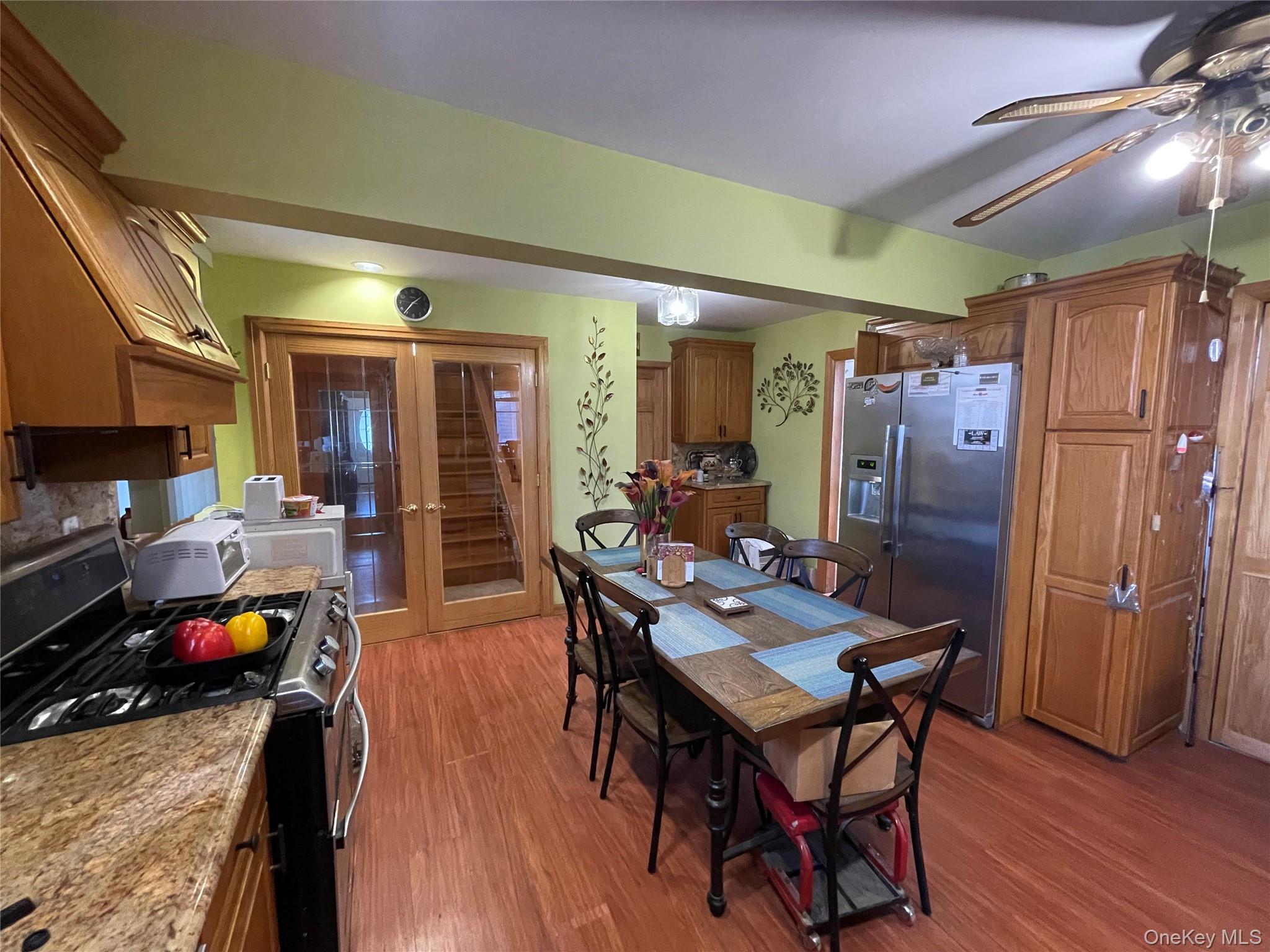 104 Ostend Road Island Park, NY 11558 - Photo 23 of 42 a view of a dining room with furniture and wooden floor