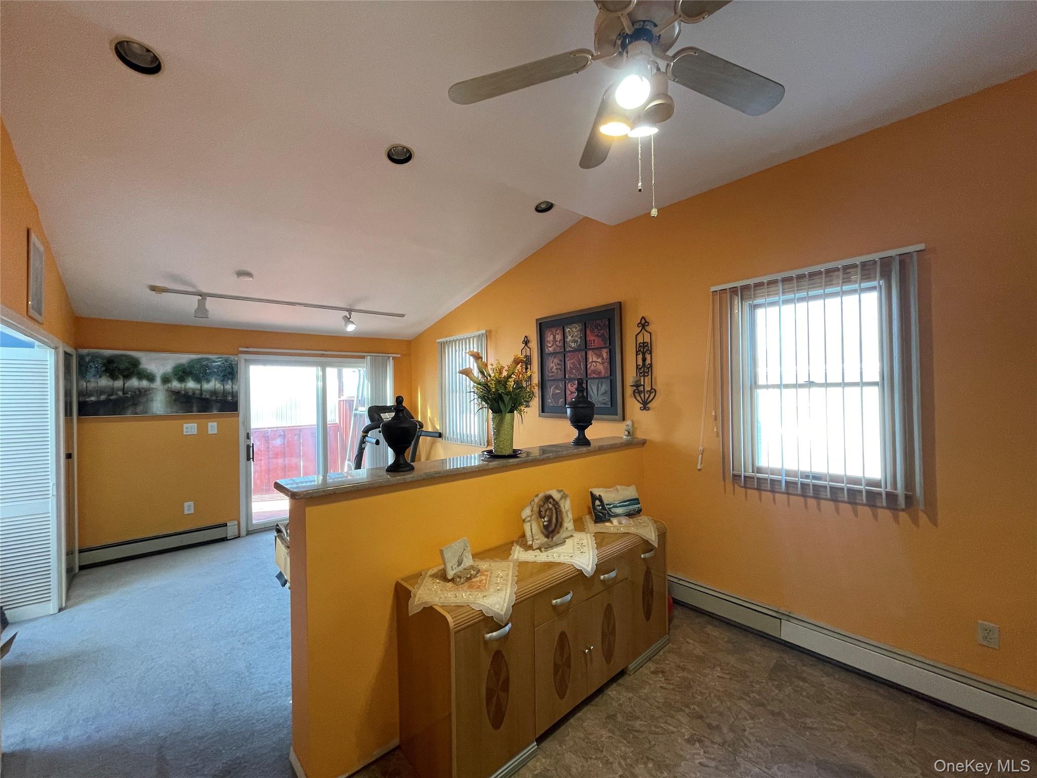 104 Ostend Road Island Park, NY 11558 - Photo 30 of 42 a bed room with furniture and a chandelier