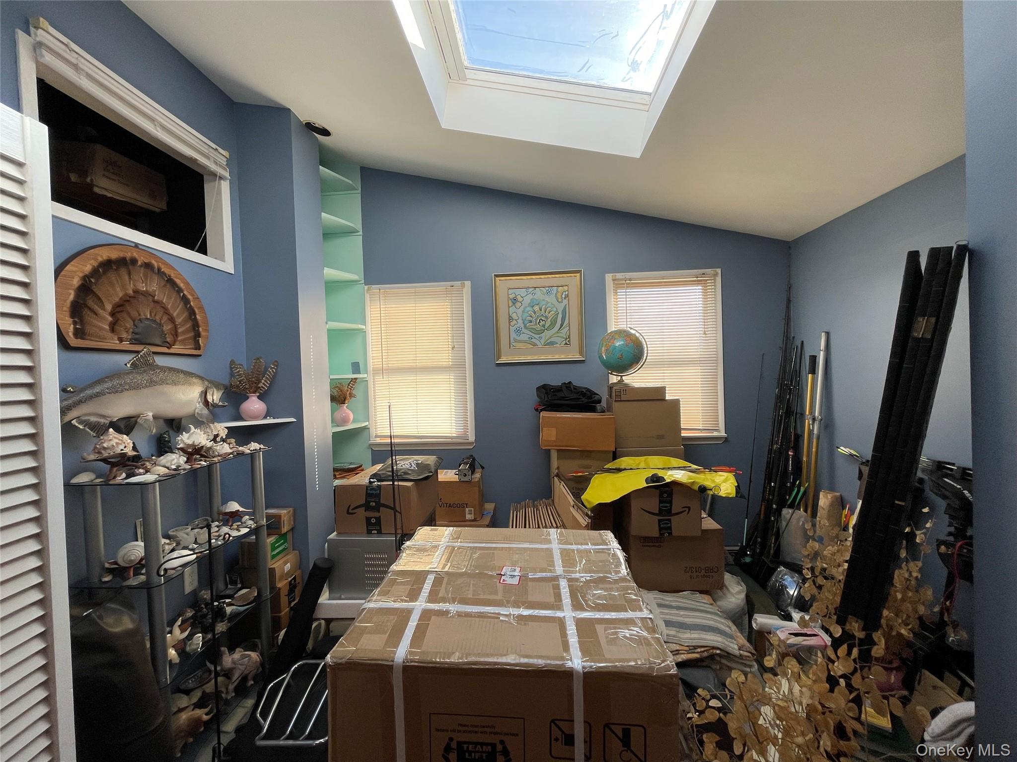 104 Ostend Road Island Park, NY 11558 - Photo 35 of 42 a living room with furniture a window and a flat screen tv