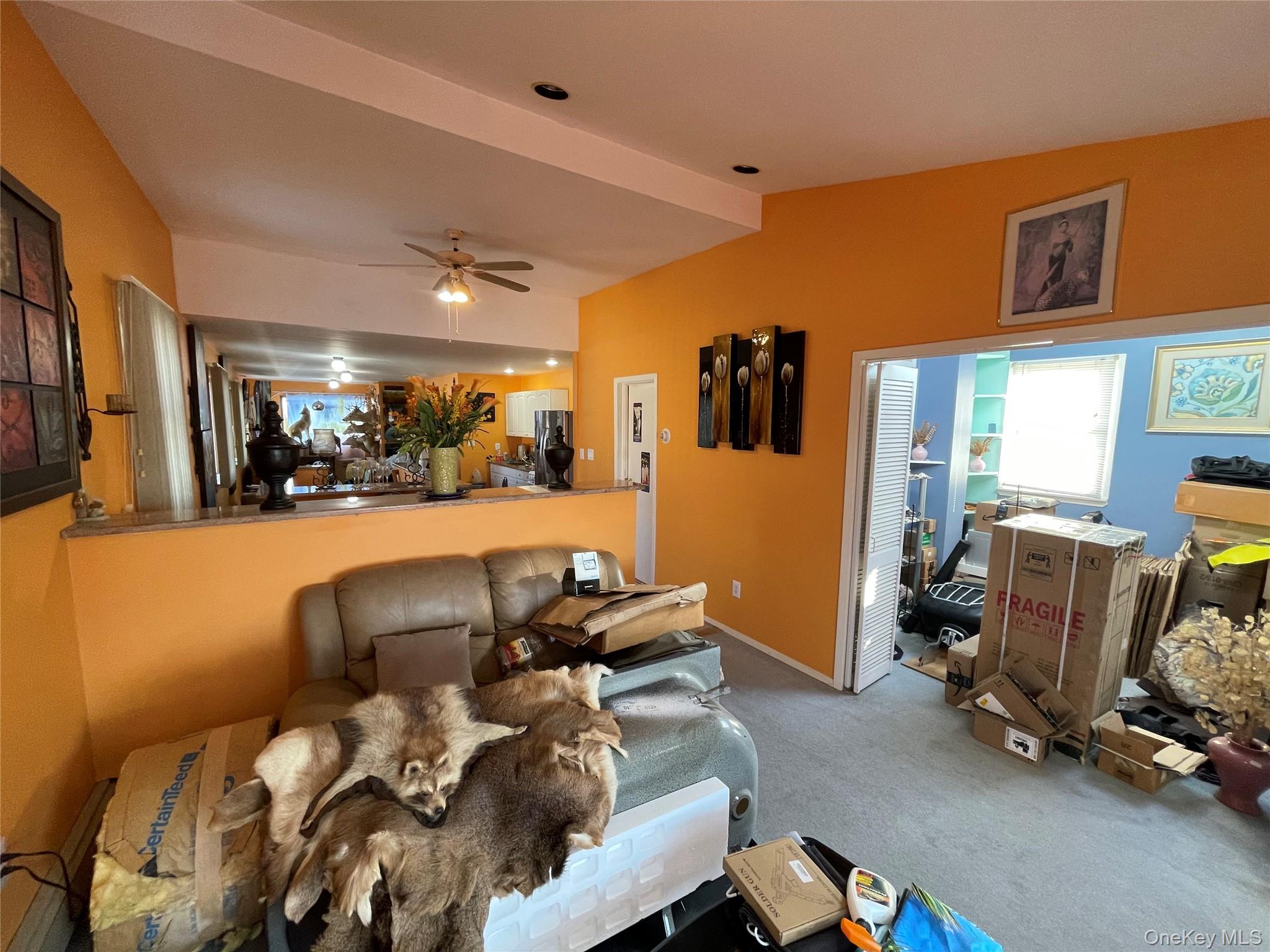 104 Ostend Road Island Park, NY 11558 - Photo 36 of 42 a living room with furniture gym equipment and a large window